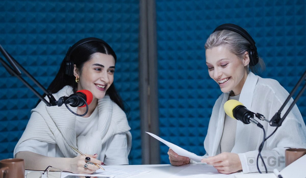 woman-doing-a-podcast-in-a-studio-wearing-headphones