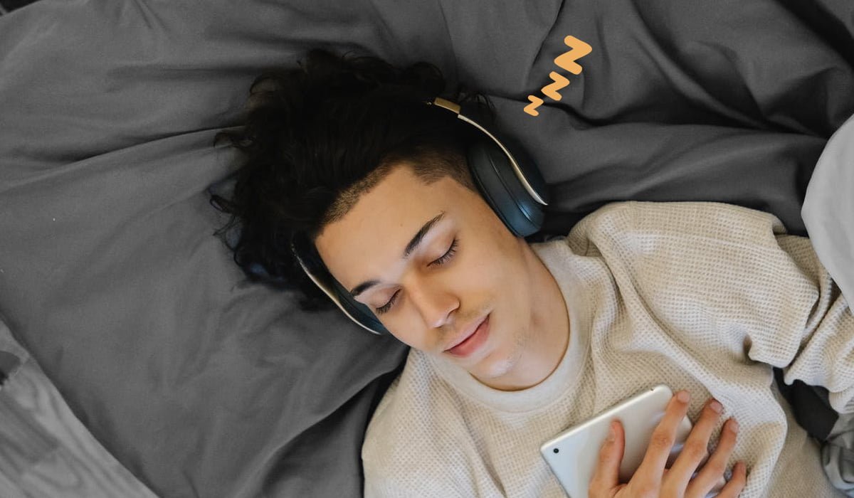 man-sleeping-with-headphones